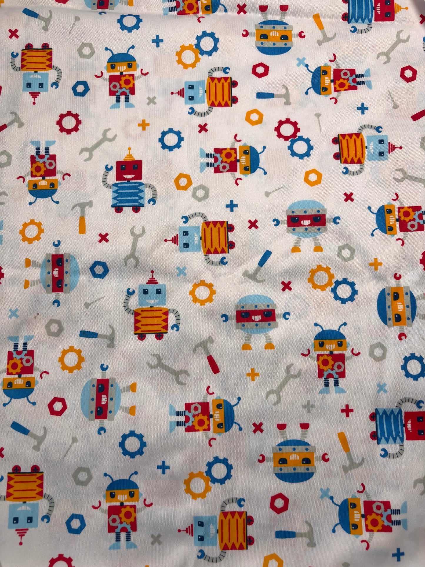 Fabric with colorful robot pattern on a white background